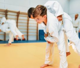 Kid judo, young fighters on training, self-defense