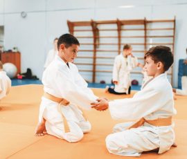 Boys in uniform practice martial art